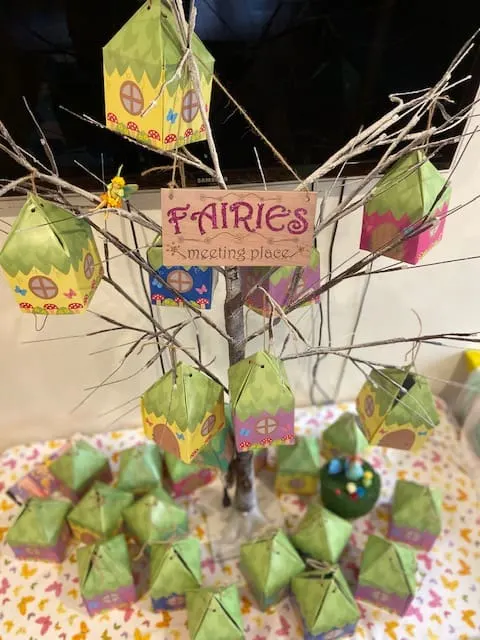 DY Fairy Favor Houses hung on a tree at a kids birthday party 
